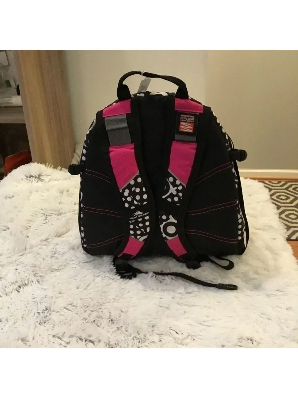 High Sierra pink black and White patterned backpack with suspension stra…